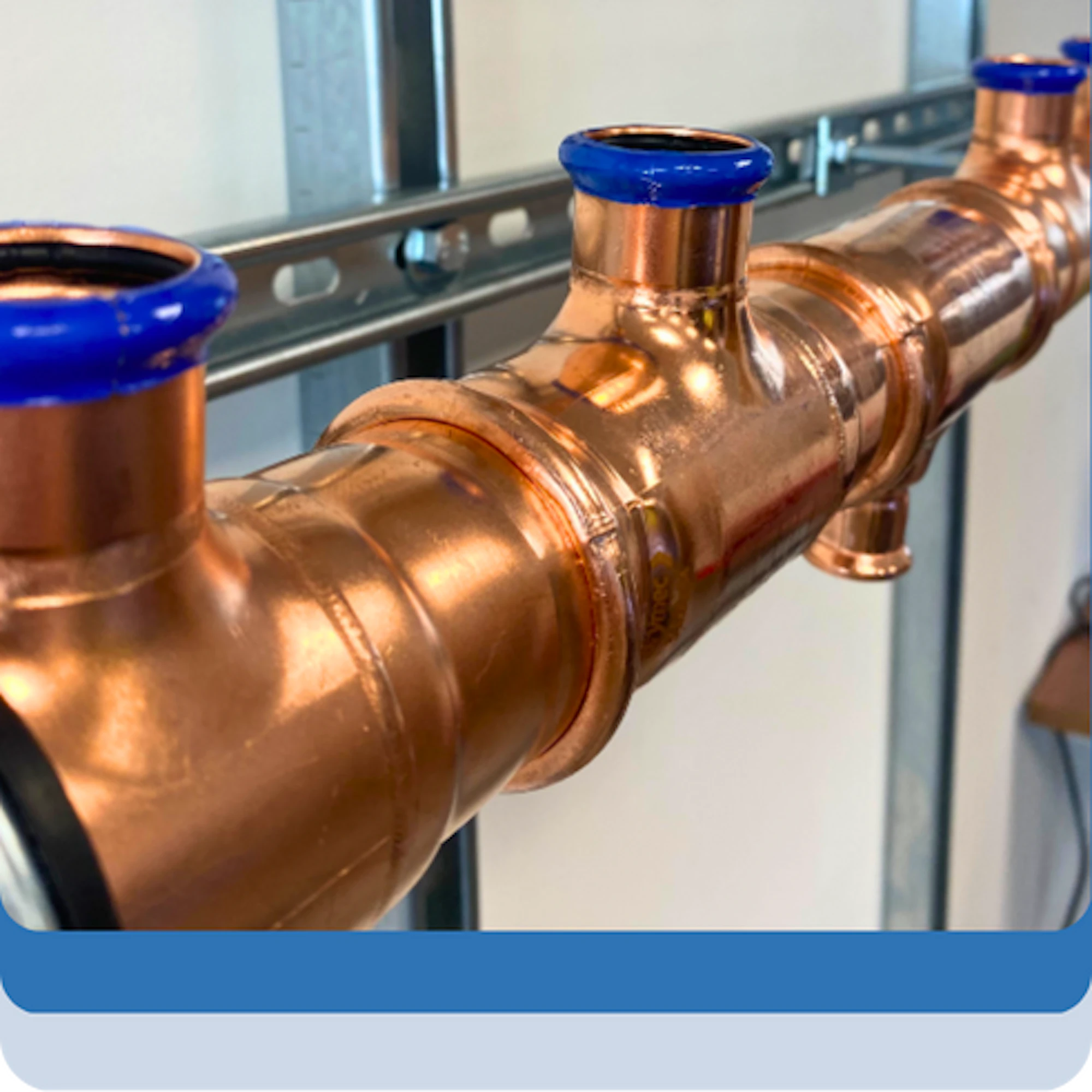 Brymec copper press manifold tees pressed together in row